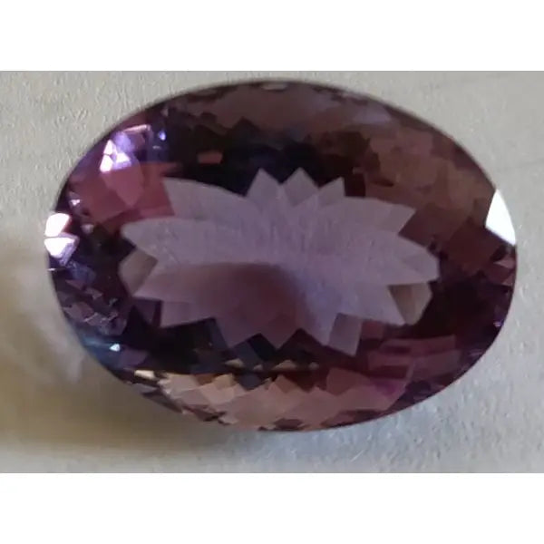 Améthyste naturelle taille ovale a facettes 19.97x14.99x10.09 mm 17.00 carats avec certificat 2