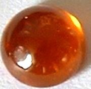 Grenat hessonite rond cabochon 7 mm 1.70 carats