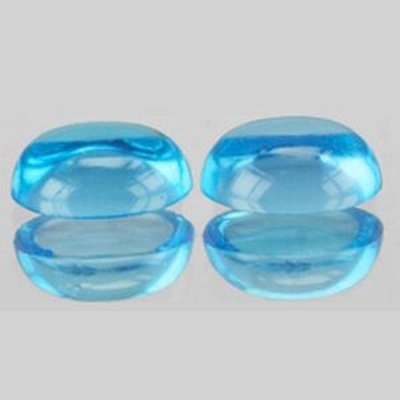 Topaze bleu suisse ovale cabochon 7x5 mm 1.20 carat