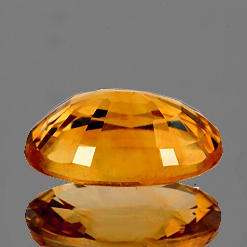 Tourmaline jaune or ovale a facettes 8.32x5.87x3.17 mm 1.08 carat