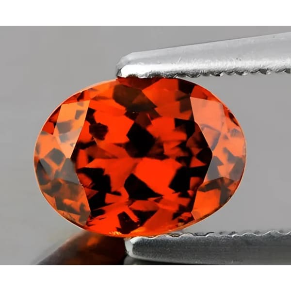 Grenat hessonite ovale a facettes 6x4 mm 0.53 carat