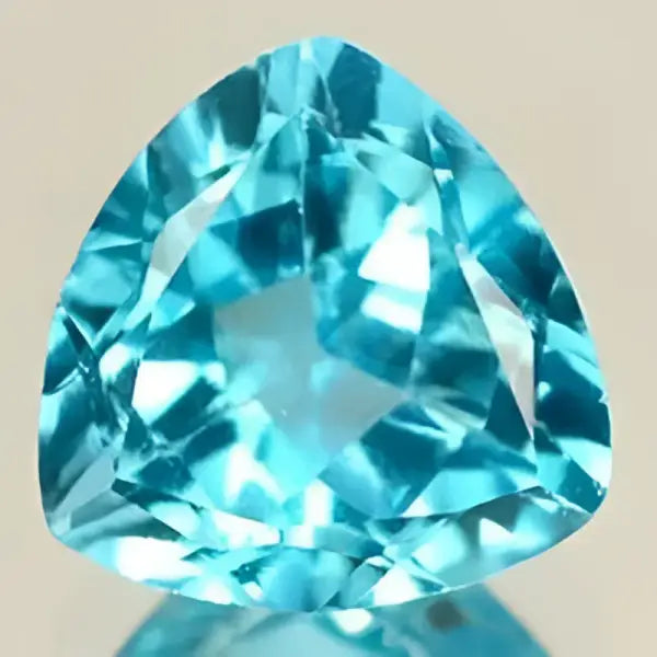 Topaze bleu suisse trilliant a facettes 7 mm 1.50 carats