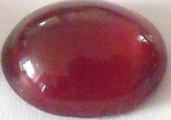 Grenat hessonite ovale cabochon 11x9 mm 3.60 carats