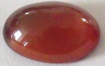 Grenat hessonite ovale cabochon 14x10 mm 6.00 carats