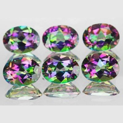 Topaze mystique ovale a facettes 6x4 mm 0.53 carat