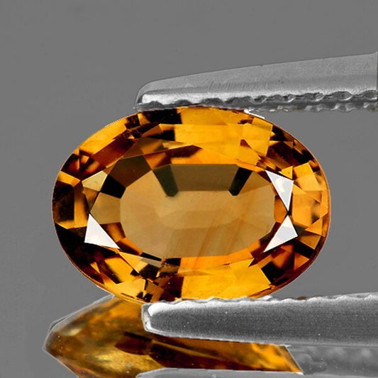 Tourmaline jaune or ovale a facettes 8.32x5.87x3.17 mm 1.08 carat