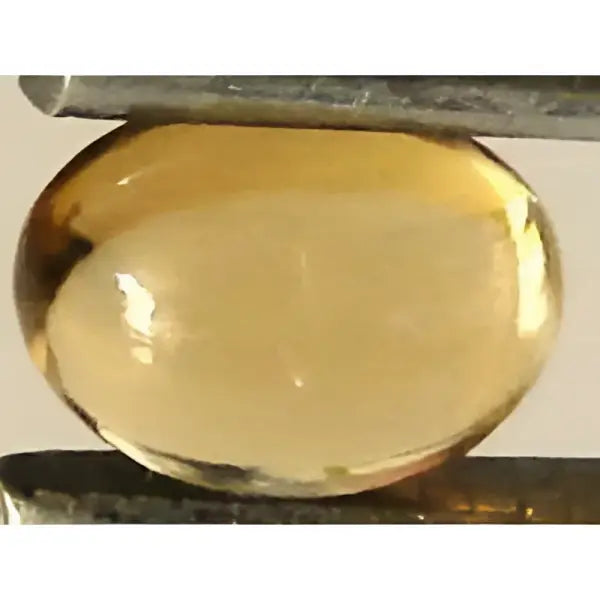 Citrine or ovale cabochon 7x5 mm 0.85 carat