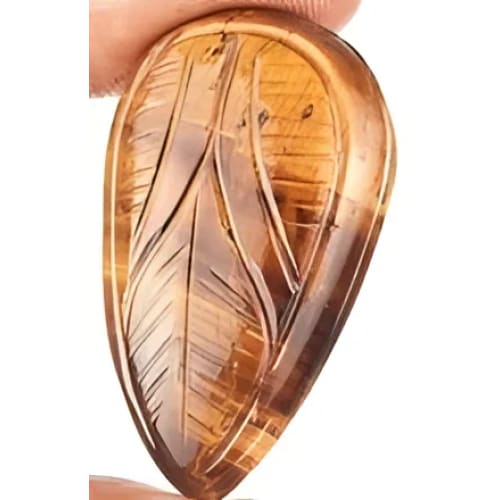 Oeil de tigre poire sculptéé 40x24x9.8 mm 72.60 carats