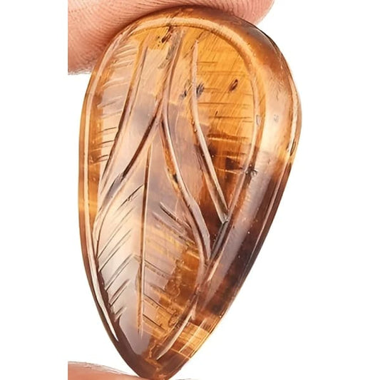 Oeil de tigre poire sculptéé 40x24x9.8 mm 72.60 carats