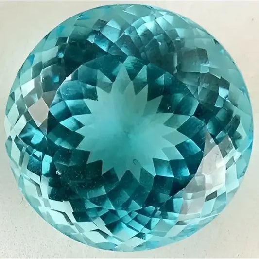 Topaze bleu suisse ronde a facettes 23.31x23.20x16.71 mm 72.00 carats avec cerificat