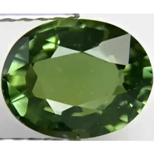 Tourmaline verte foncée ovale a facettes 9x7 mm 1.88 carat